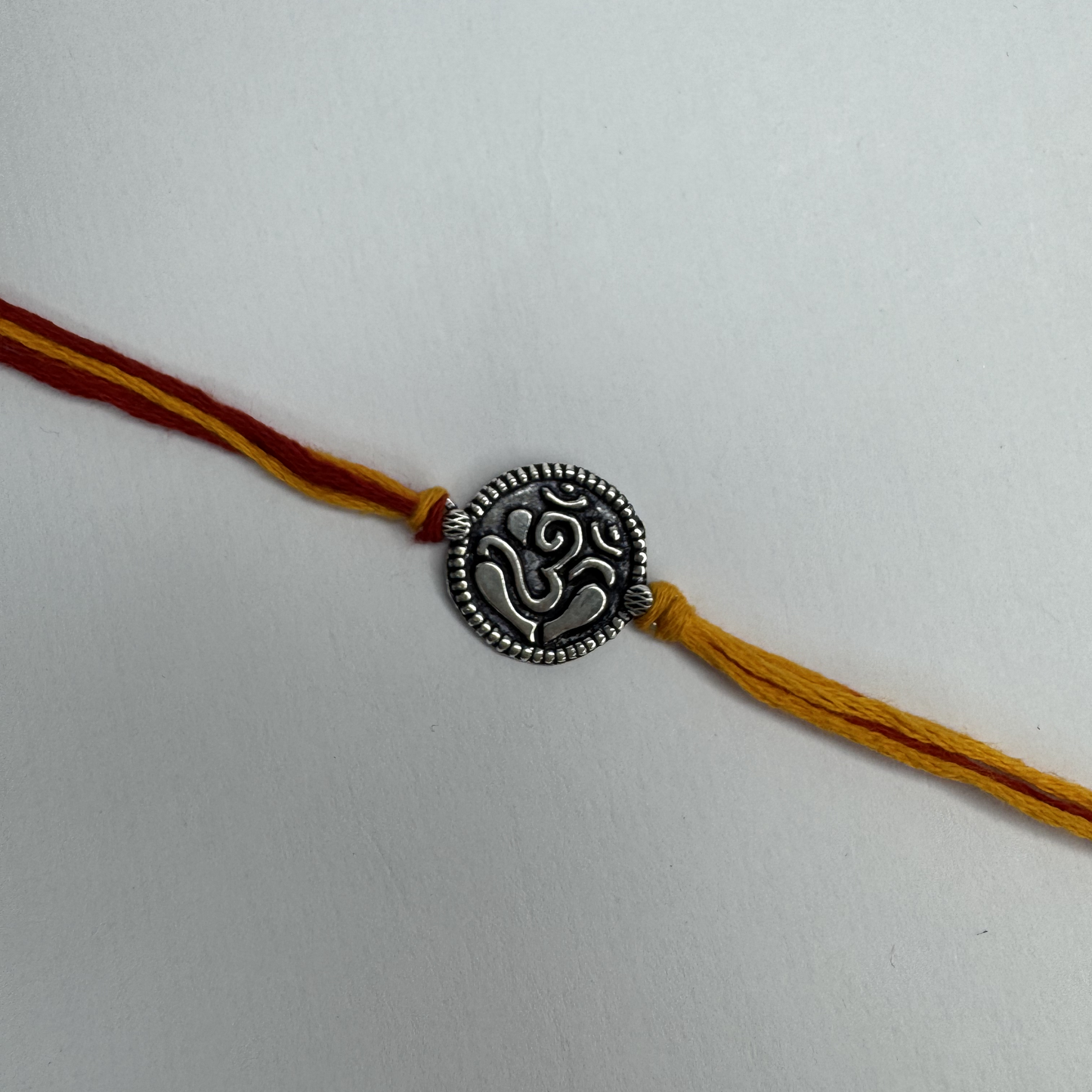 Om Silver Rakhi – Classic