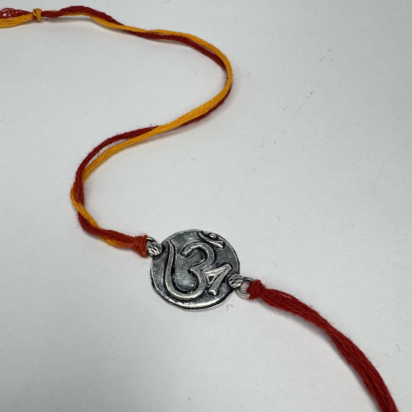 Om Silver Rakhi – Petite
