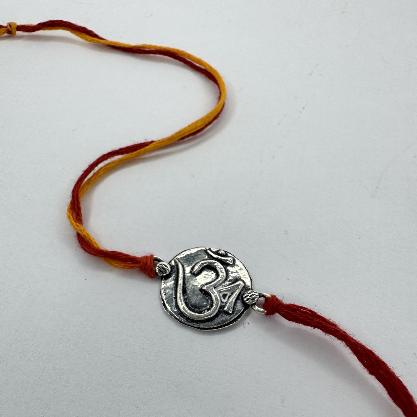 Om Silver Rakhi – Petite