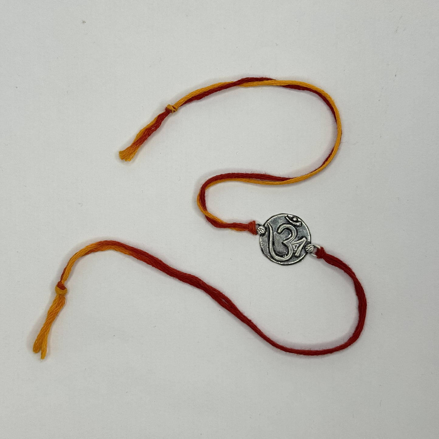 Om Silver Rakhi – Petite