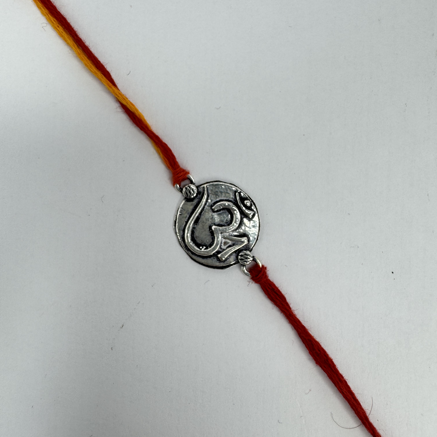 Om Silver Rakhi – Petite