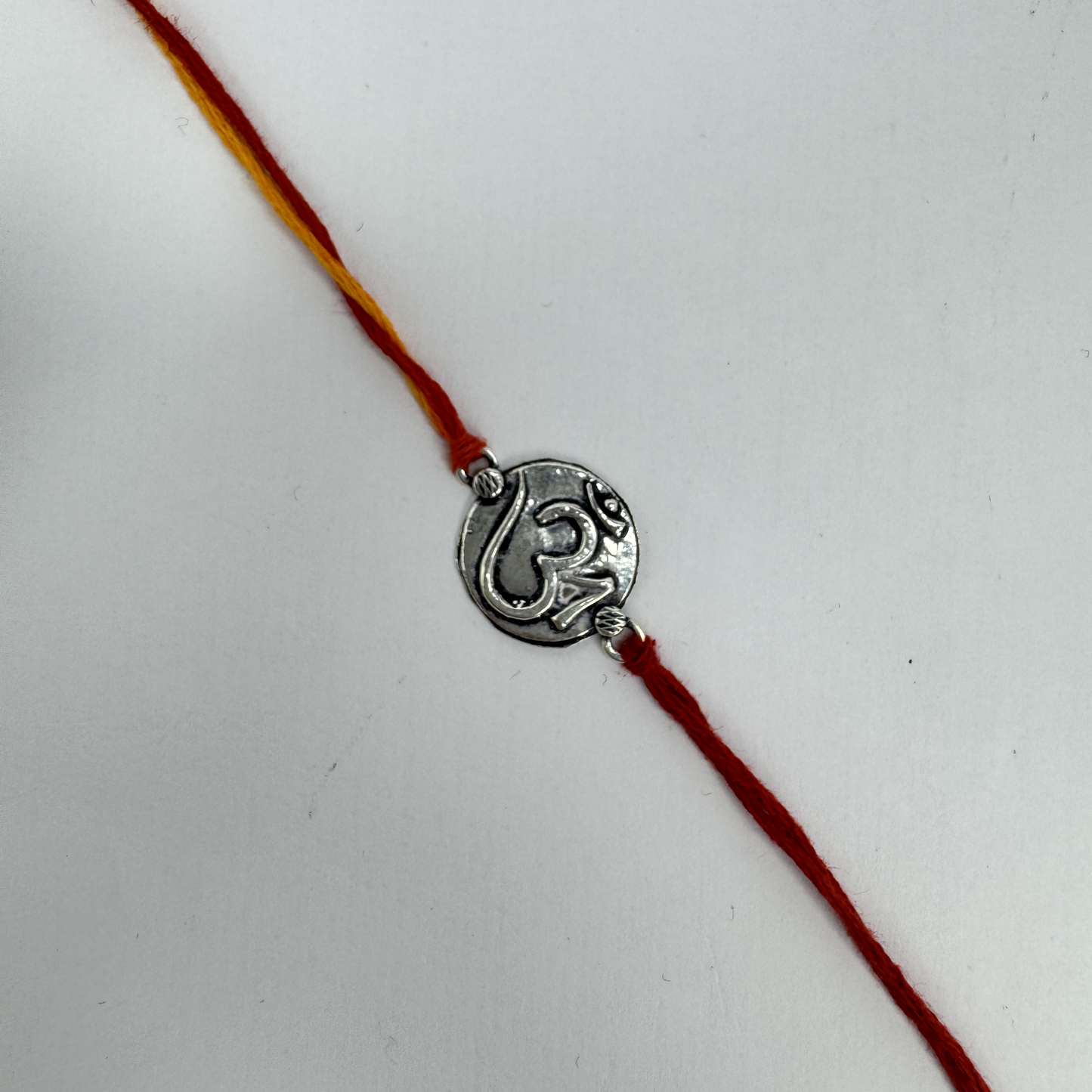 Om Silver Rakhi – Petite